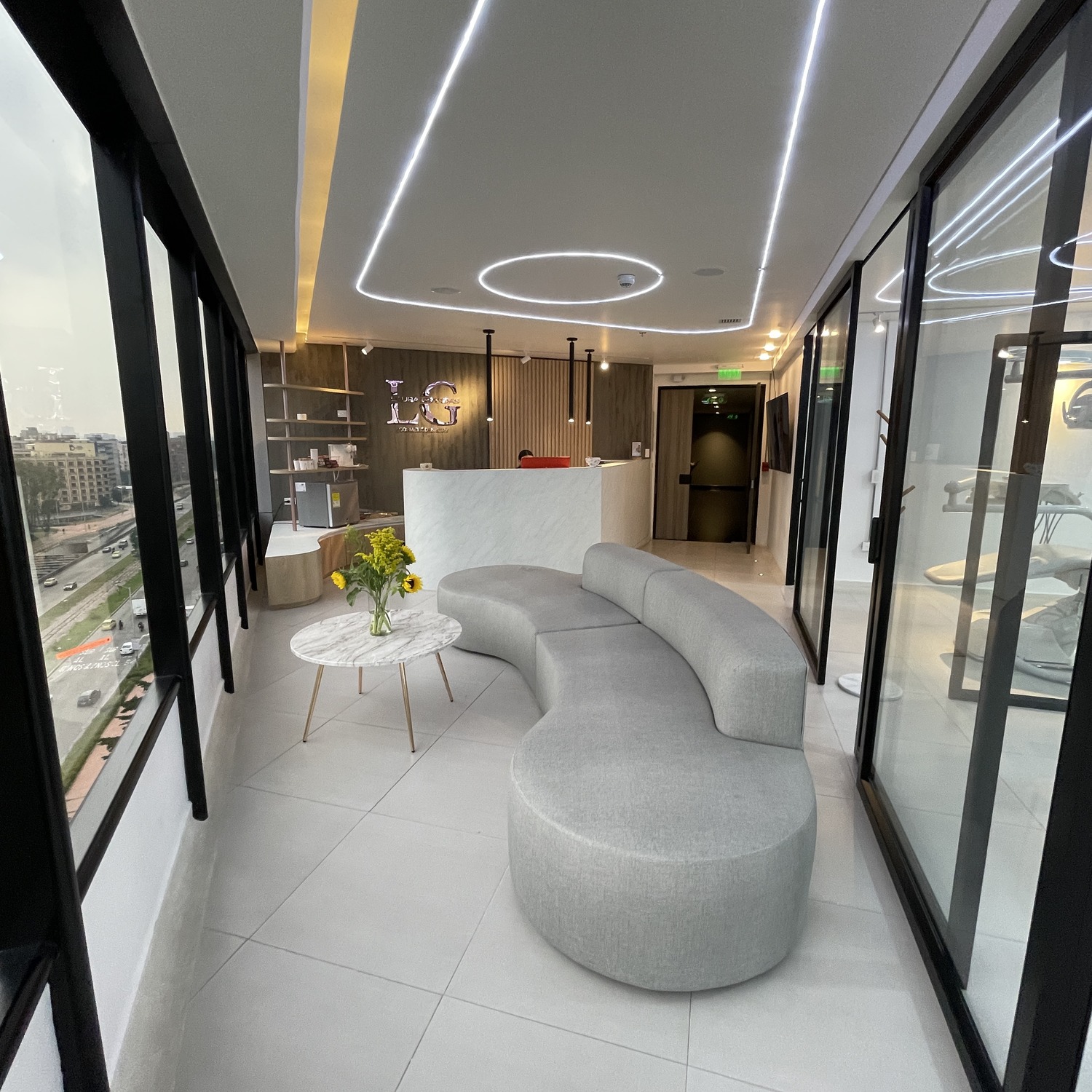 mobe-dental-clinic-waiting-area-curved-sofa-led-ceiling